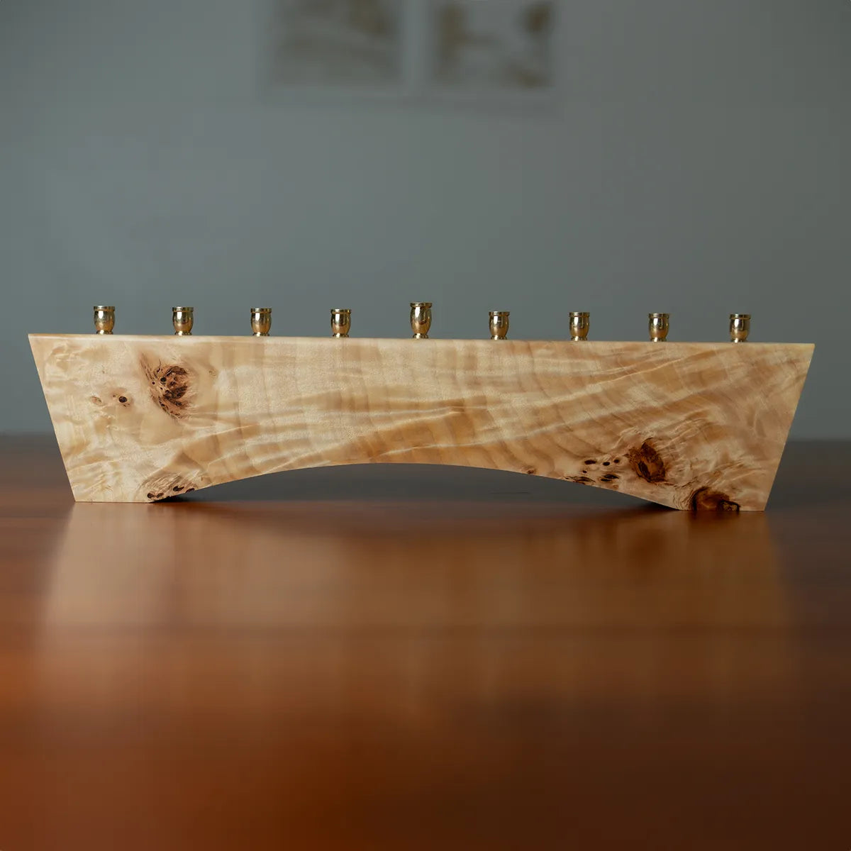 Limited edition wood menorah with swirling golden grain