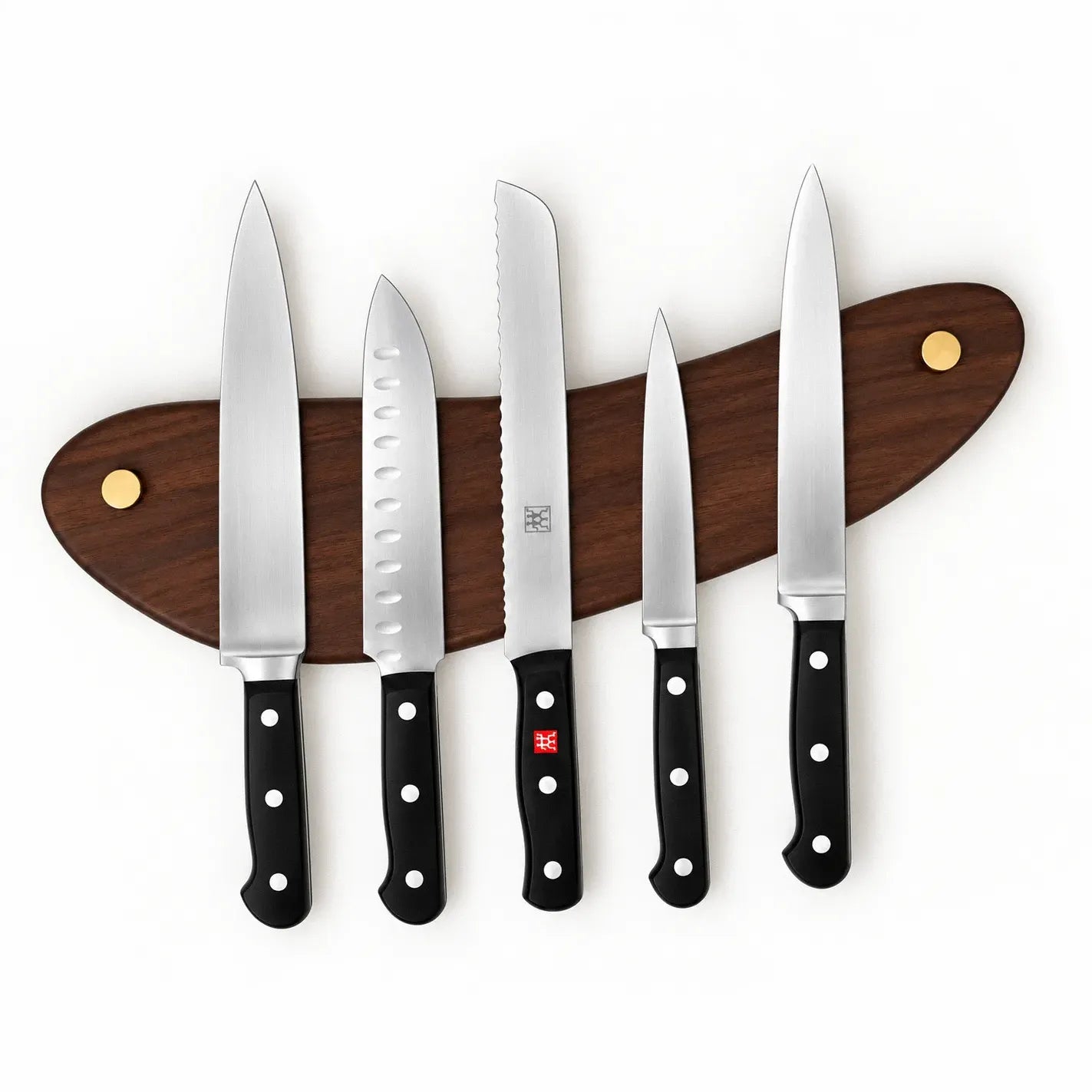 The same walnut knife rack mounted with two and a half inches of rake, the curve rising to the right while the knives hang straight down