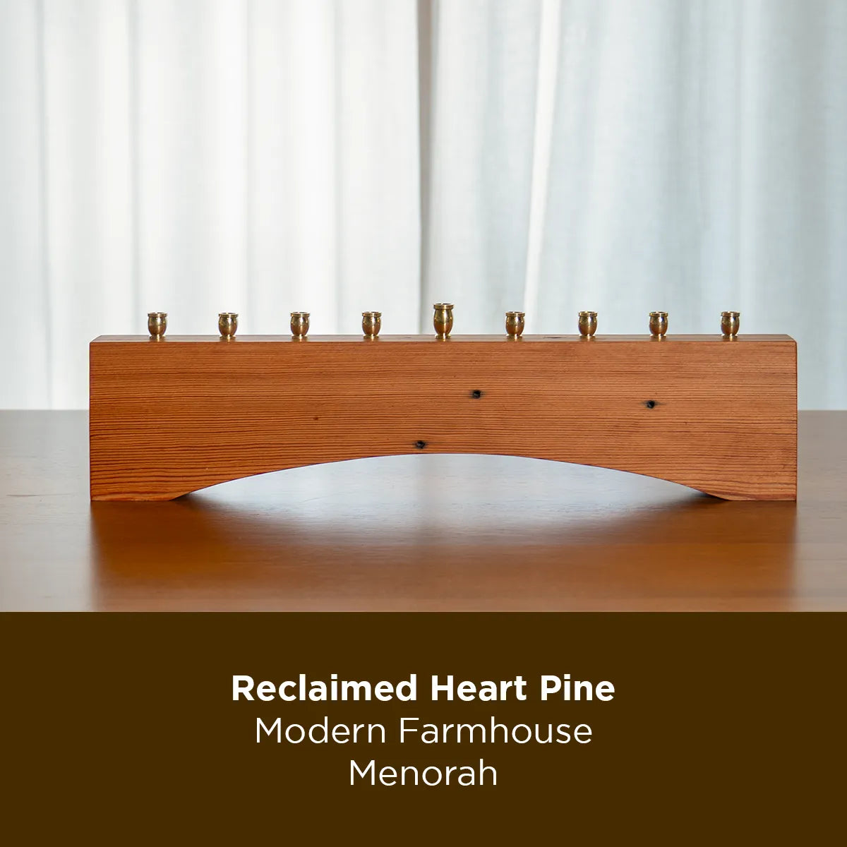 500 Miles farmhouse menorah made from reclaimed heart pine, shown with brass candle holders on a table.