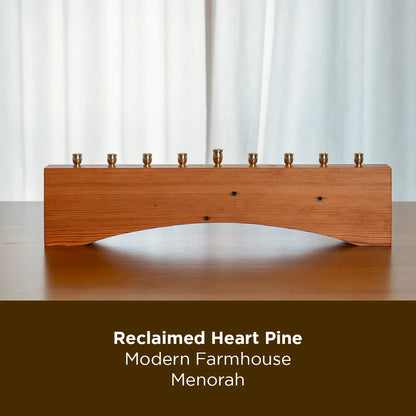 500 Miles farmhouse menorah made from reclaimed heart pine, shown with brass candle holders on a table.