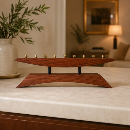 Modern wooden menorah titled “East of the Sun, West of the Moon,” handcrafted from walnut and ebony-stained oak.