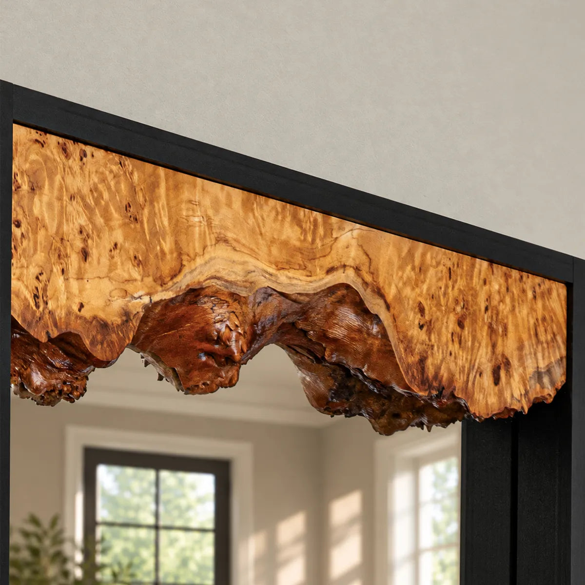Close view of the live edge where the burl meets the mirror glass, showing the natural edge and figured grain