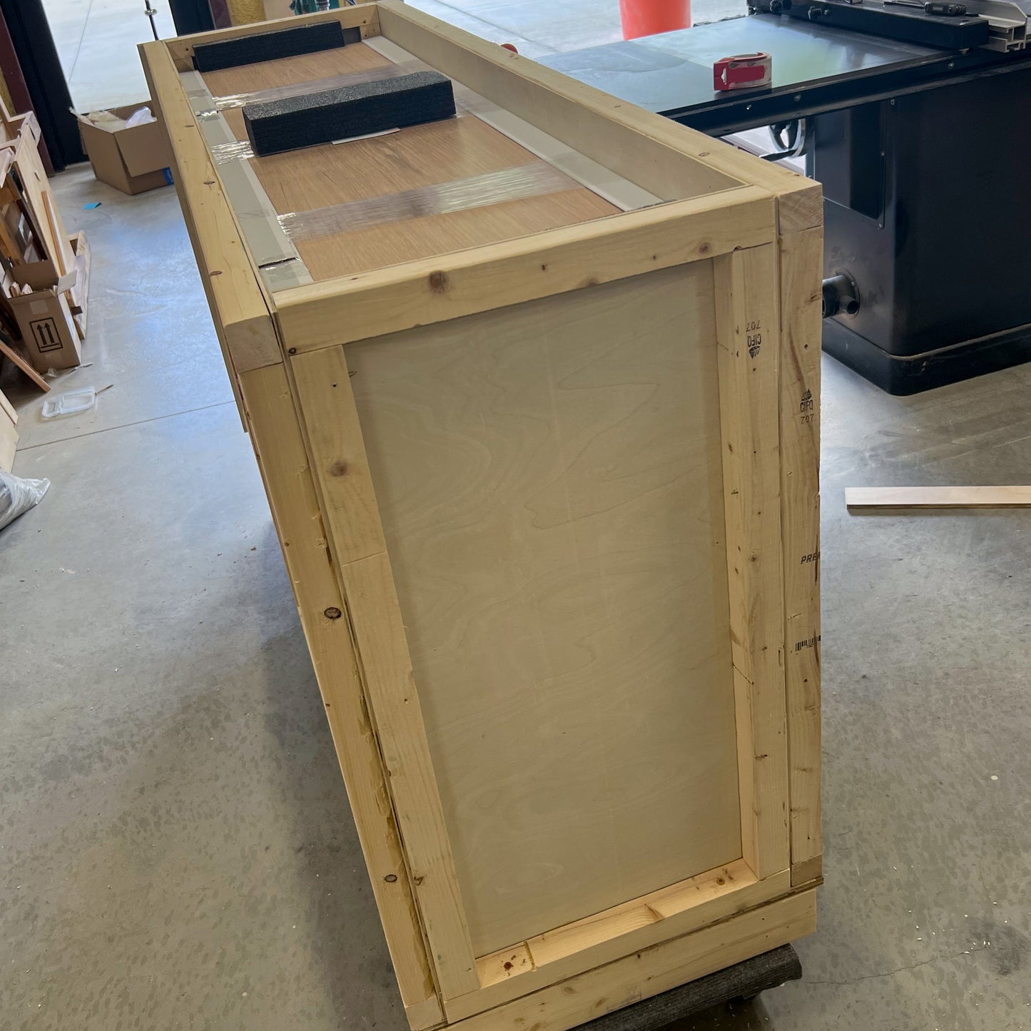 Custom-built shipping crate for the Summer Breeze coastal media console, ensures safe delivery of white oak and rattan TV stand