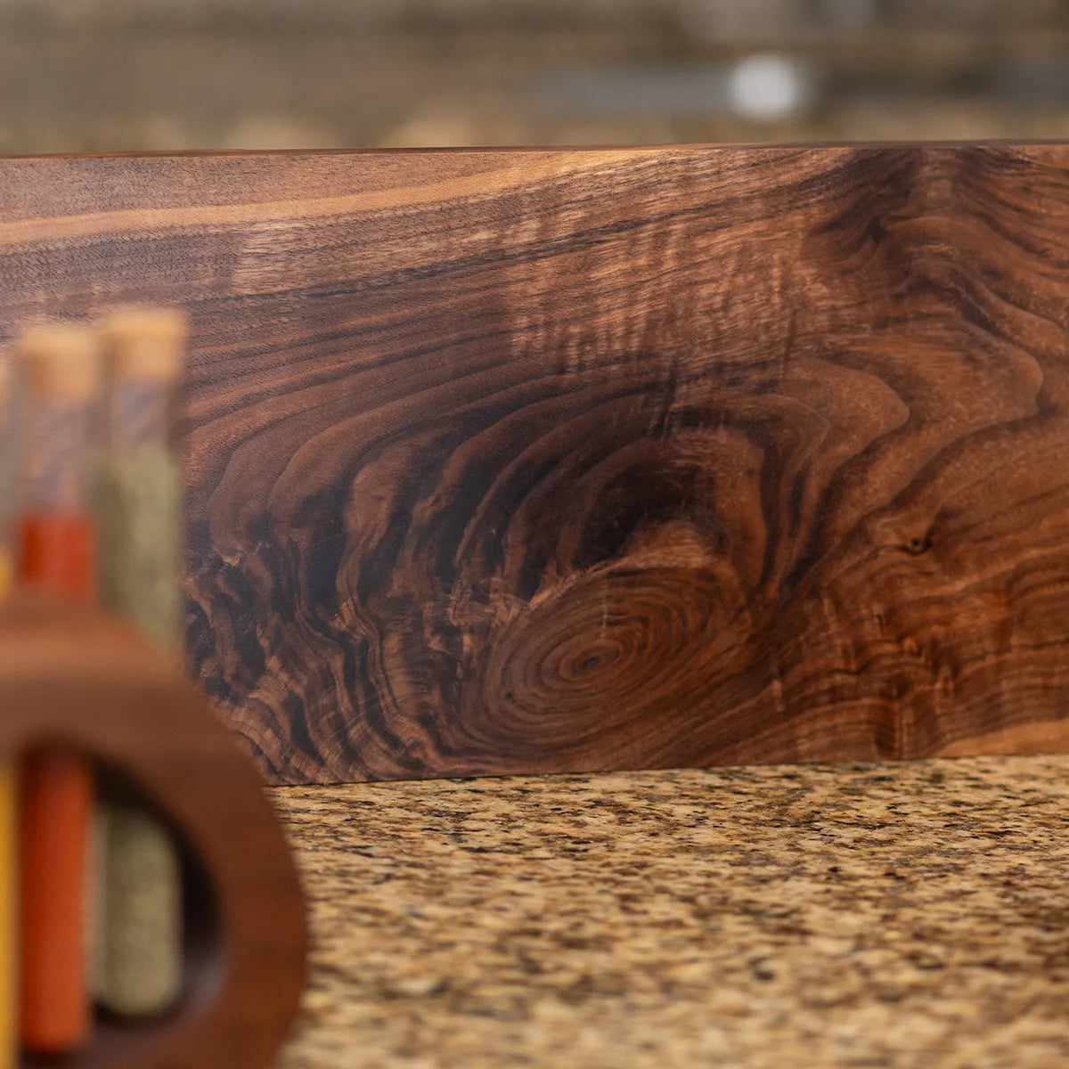 Close-up of figured walnut grain showing natural movement and depth in the wood