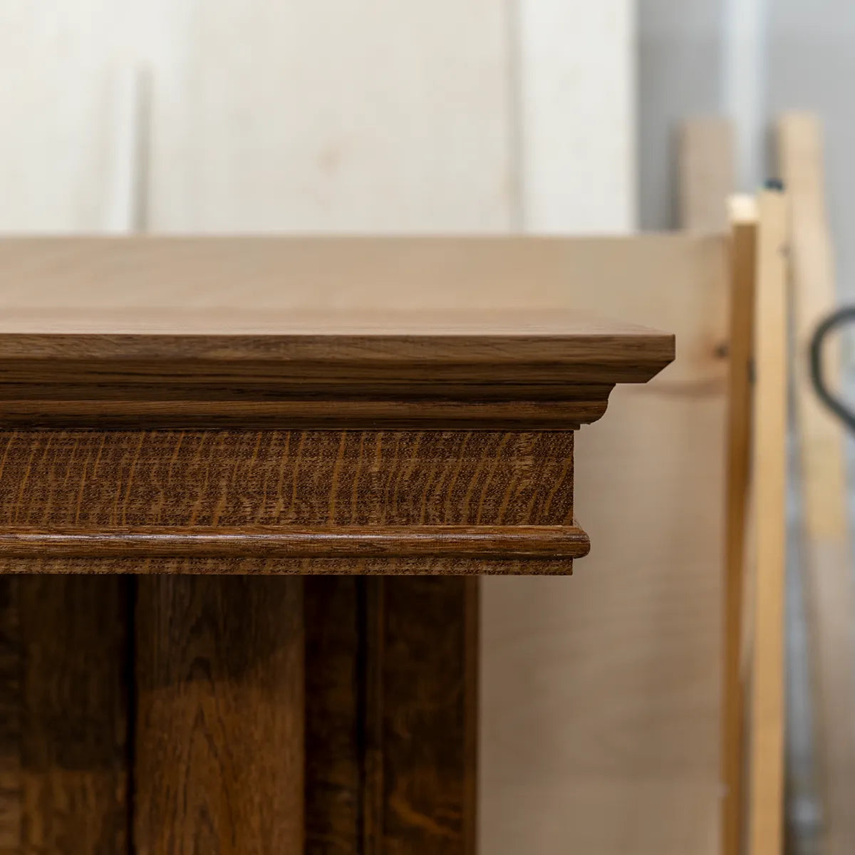 Custom fireplace surround in progress in woodworking studio, showing craftsmanship and construction details