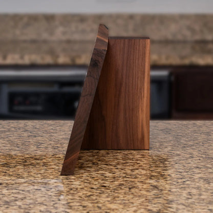 Side profile showing the angled form and solid walnut construction of the Child of Nature knife block