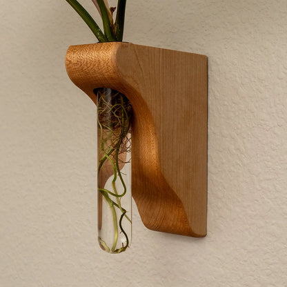 Hang On Sloopy wall-mounted propagation station in maple, sculptural wood vase holder with glass tube for plant cuttings, modern handmade wall decor