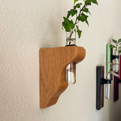 Hang On Sloopy wall-mounted propagation station in oak, sculptural wood vase holder with glass tube for plant cuttings, modern wall decor