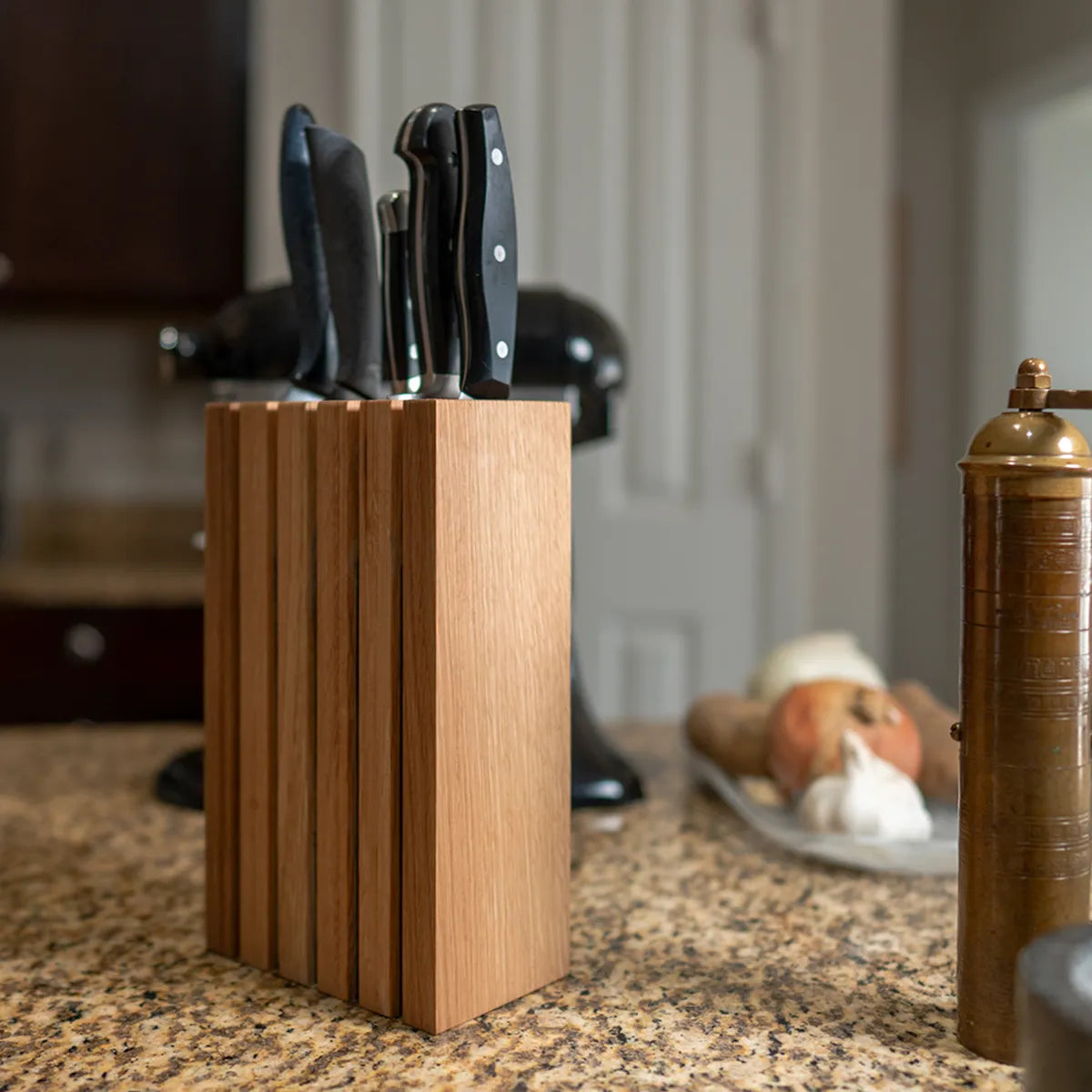 3/4 view of The Chain knife block in white oak