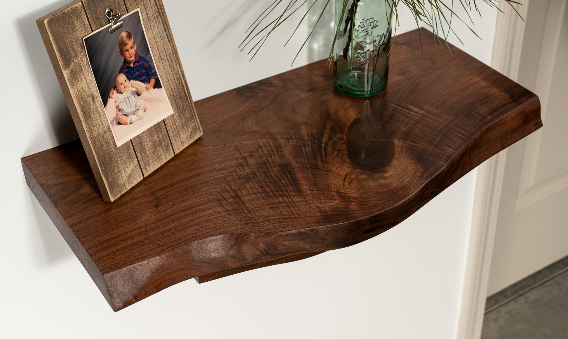 a detailed view of a live edge walnut floating table