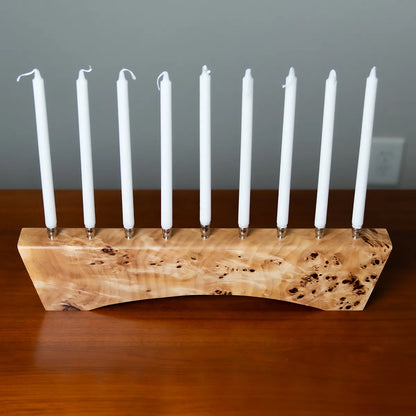 Top view of the Hey Jude menorah in solid Mappa burl with polished nickel candle cups