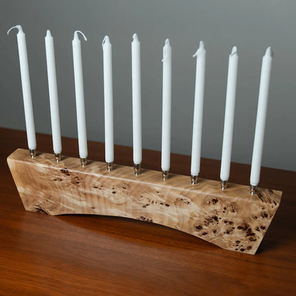 Side view of solid Mappa burl menorah signed and numbered