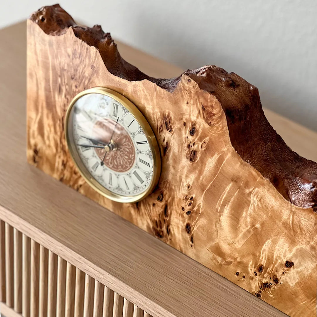 angle profile of the Signature Series mappa burl mantel clock, highlighting natural edge and wood grain. 