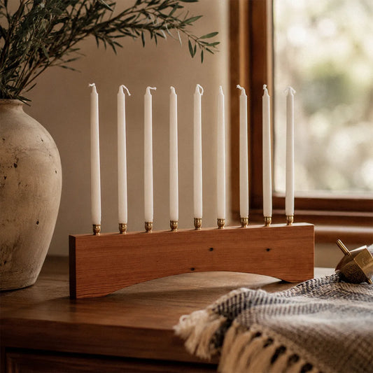 Modern farmhouse Hanukkah menorah handmade from reclaimed heart pine with an arched base and nine brass candle holders