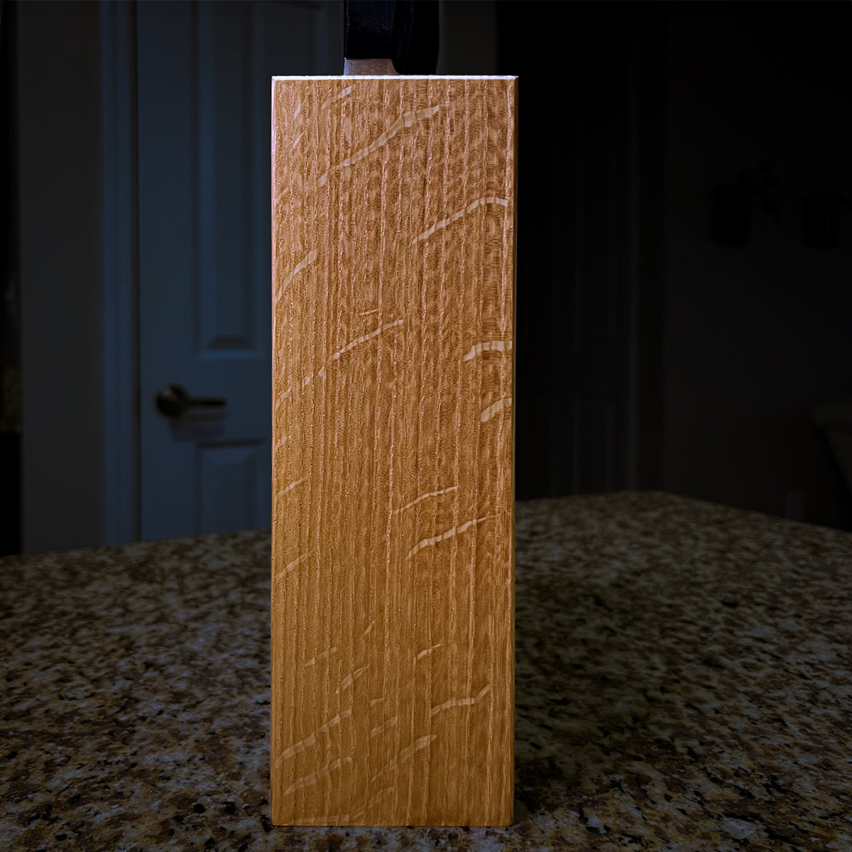 End view of the Chain Knife Block in quarter-sawn white oak, showing straight grain and ray fleck