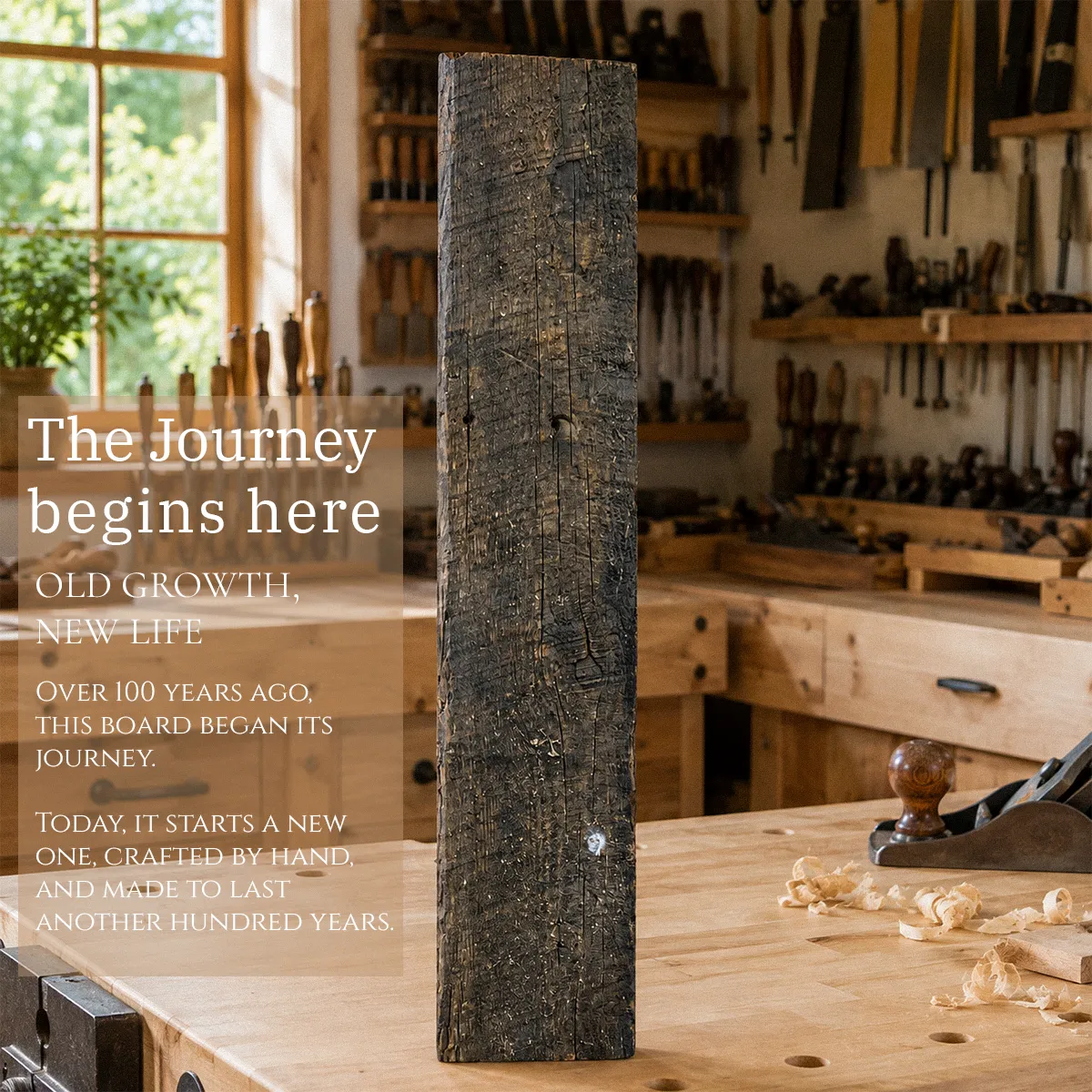 A weathered century-old reclaimed heart pine beam standing on a workbench in a woodworking shop, the raw material before it is crafted by hand into a finished piece