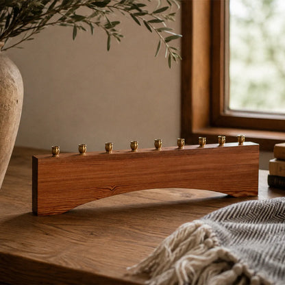 Modern farmhouse Hanukkah menorah handmade from reclaimed heart pine, with nine brass candle cups and an arched base