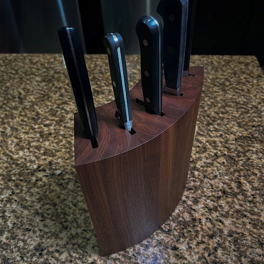 Mid-century modern walnut knife block with curved sculptural form, handcrafted from solid American black walnut.