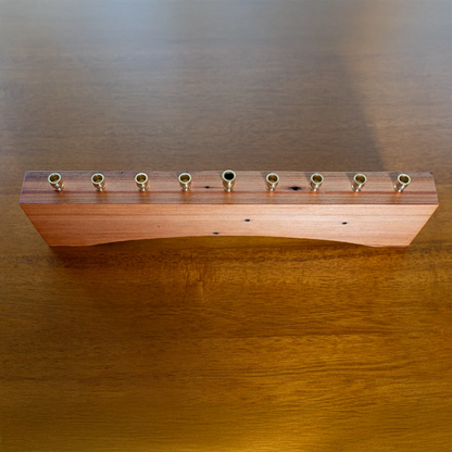 a rustic menorah made from 100 year old reclaimed heart pine complete with its stories it has to tell.