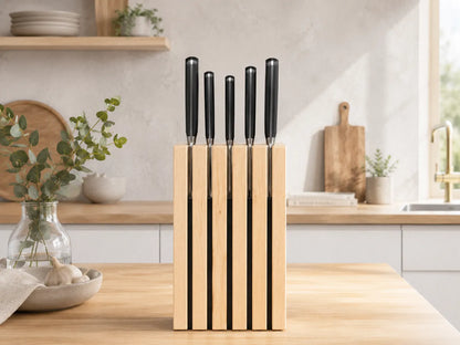Front view of The Chain knife block in hard maple holding kitchen knives