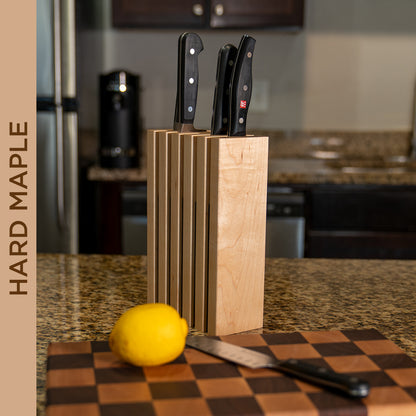 The Chain knife block in hard maple holding kitchen knives