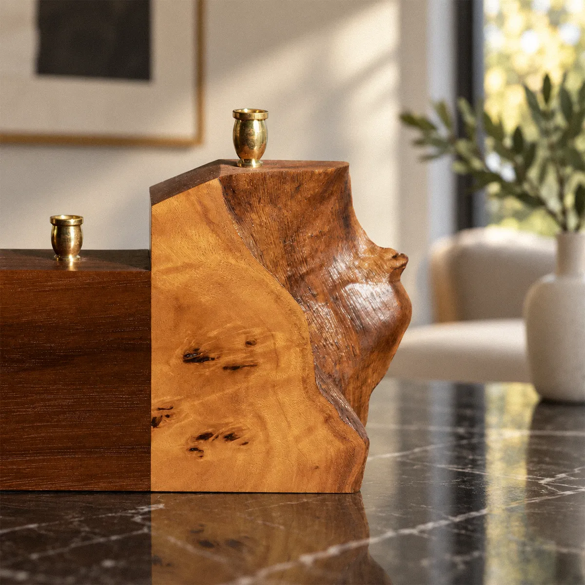 Close-up of the Mappa burl and walnut on the Piece of My Heart menorah, with the shamash cup raised on the live-edge burl block.