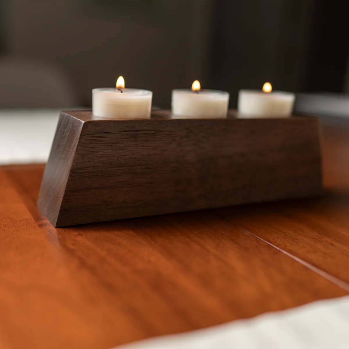 a walnut tea light in walnut as a centerpiece