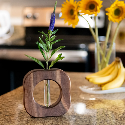 Small Will It Go Round in Circles propagation vase in walnut – compact version with single glass tube.