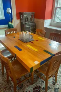 reclaimed gym floor tabletop in its forever home